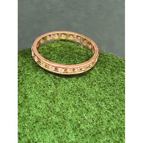 93 - A 9ct gold eternity ring set with clear stones