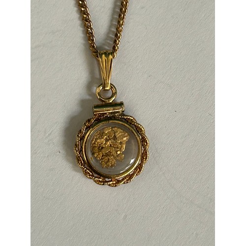 79 - A Vintage 12ct gold double sided locket containing 24ct pure gold from Sofala NSW Australia, on a gi... 