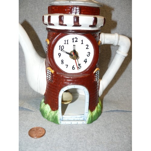 68 - CERAMIC TEAPOT CLOCK IN THE FORM OF A WINDMILL OR TOWER, BATTERY OPERATED.