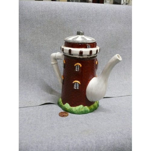 68 - CERAMIC TEAPOT CLOCK IN THE FORM OF A WINDMILL OR TOWER, BATTERY OPERATED.