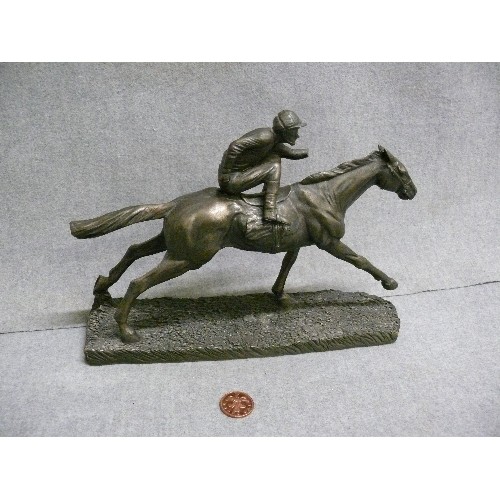 104 - JOCKEY & HORSE IN ANTIQUED PEWTER EFFECT RESIN. SOME DAMAGE TO JOCKEY.