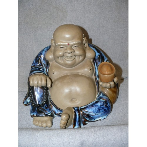 131 - LARGE HEAVY CERAMIC LAUGHING BUDDHA.