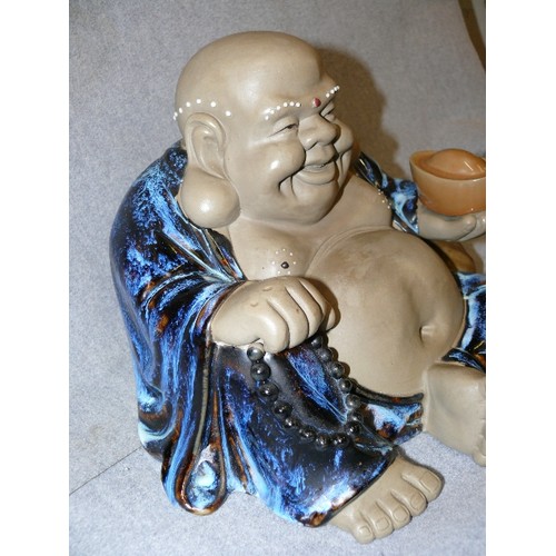 131 - LARGE HEAVY CERAMIC LAUGHING BUDDHA.