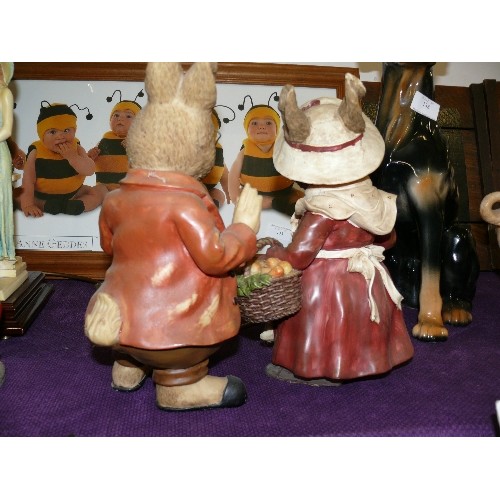 139 - MR & MRS RABBIT. LARGE RESIN FIGURES COMPLETE WITH SPECS AND HATS ETC.