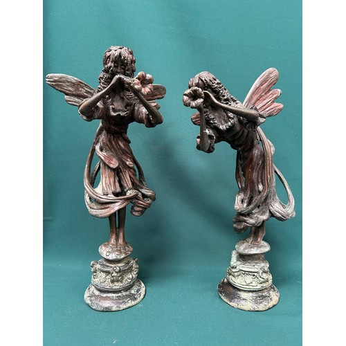 269 - A stunning pair of solid bronze figures of fairies with flower trumpets, standing on toad stools sur... 