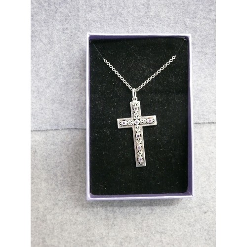 44 - A SOLID SILVER CROSS WITH CELTIC FRETWORK DESIGN PLUS 7 AMETHYSTS SET INTO IT ON A 20 INCH SILVER CH... 