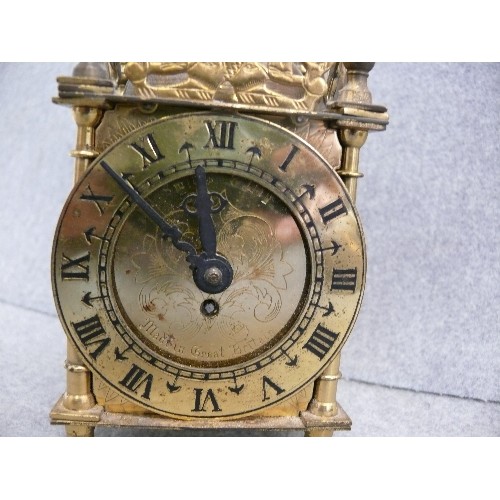 47 - A BRASS CARRIAGE CLOCK WITH KEY BY SMITHS, CLOCK WORKING BUT BODY NEEDS T L C