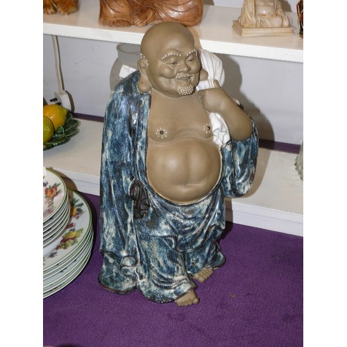 114B - LARGE CERAMIC BUDDHA IN BLUE ROBES, WITH WHITE SACK.