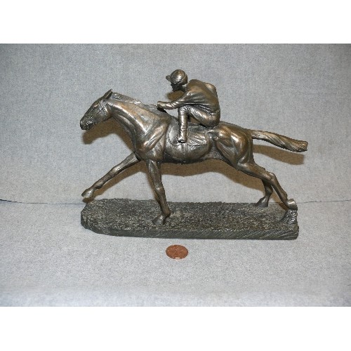 104 - JOCKEY & HORSE IN ANTIQUED PEWTER EFFECT RESIN. SOME DAMAGE TO JOCKEY.