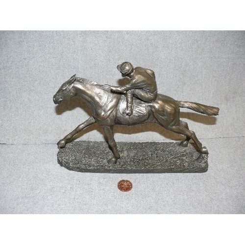 104 - JOCKEY & HORSE IN ANTIQUED PEWTER EFFECT RESIN. SOME DAMAGE TO JOCKEY.