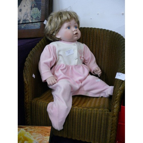 127 - LARGE PORCELAIN BABY DOLL IN PINK BABYGRO FROM LEONARDO COLLECTION.