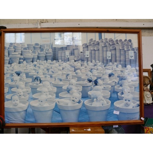 151 - LARGE ANNE GEDDES PHOTOGRAPH OF BABIES IN PLANT-POTS AT THE GARDEN CENTRE. FRAMED/GLAZED.