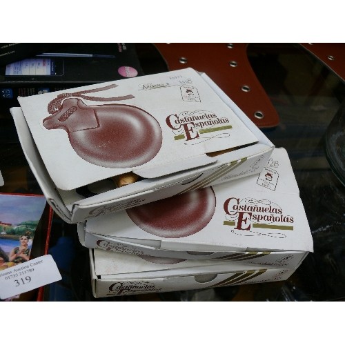 319 - 4 BOXED SETS OF WOODEN CASTANETS