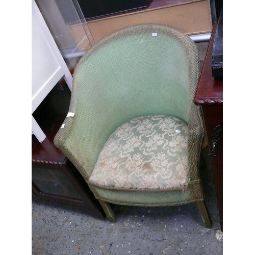 400 - LLOYD LOOM GREEN COMMODE CHAIR (DECORATED WITH A PLANT)