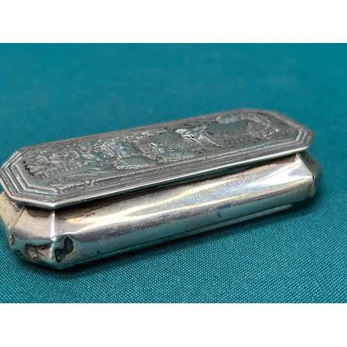 136E - Victorian Sterling Silver snuff box in the Continental style, the lid decorated with design of figur... 