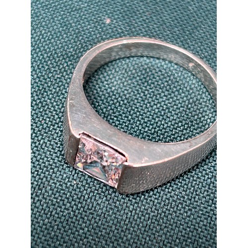 136L - Gents sterling silver dress ring, marked 925, with square cut clear stone.