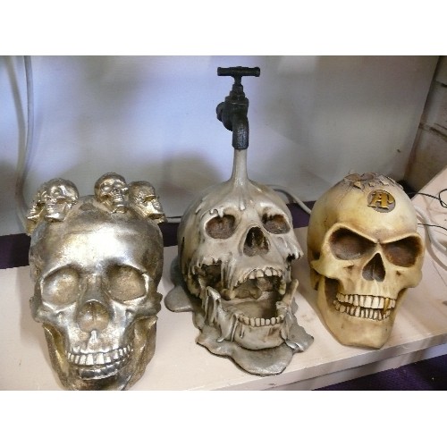 62 - 3 LARGE HEAVY SKULL FIGURES, ONE WITH TAP AND ONE BY ALCHEMY POKER