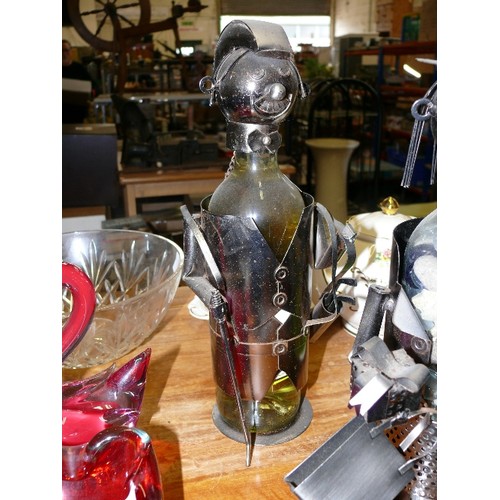 158 - A PAIR OF NOVELTY WINE BOTTLE HOLDERS, A GOLFER AND A LADY SHOPPER