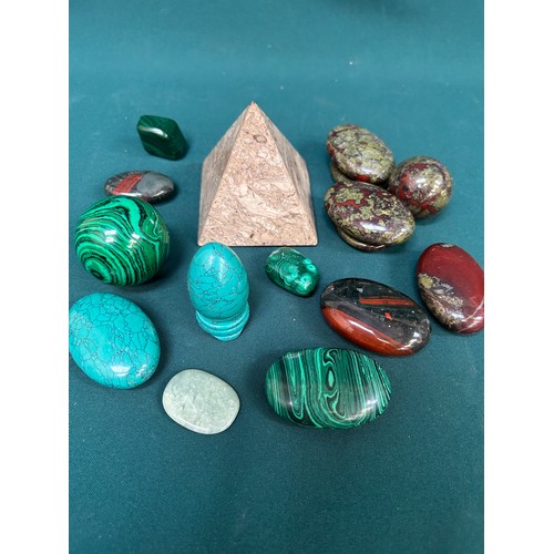 266A - A collection of polished stones including dragon blood jasper palm stones, malachite, turquoise, fos... 