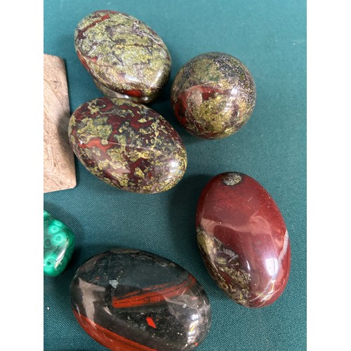 266A - A collection of polished stones including dragon blood jasper palm stones, malachite, turquoise, fos... 
