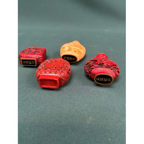 265 - A collection of Chinese snuff bottles, three in Cinnabar type lacquer and one in carved resin.