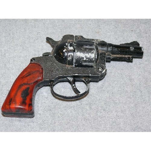 126A - A SMALL BLACK CAP GUN REVOLVER