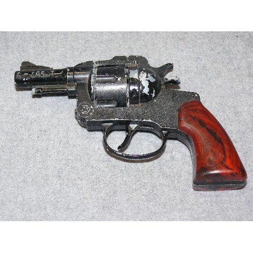 126A - A SMALL BLACK CAP GUN REVOLVER