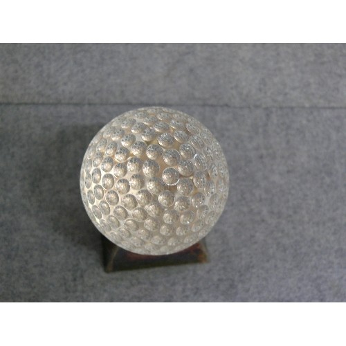20 - AN INDENTED GLASS BALL (GOLF?) ON A HEAVY STAND