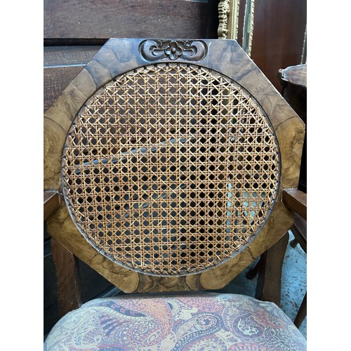 452 - An Art Deco low elbow chair with canework and walnut graining to the octagonal back