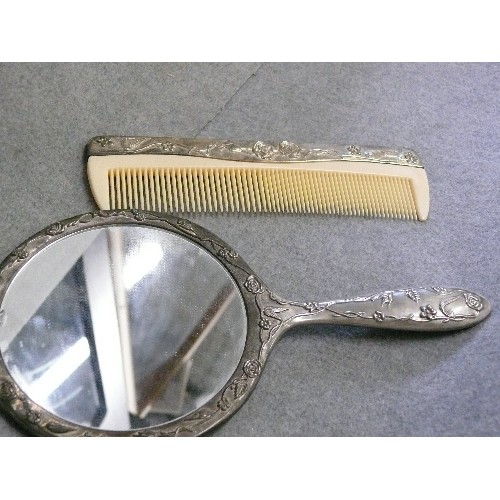 32 - DRESSING TABLE MIRROR AND COMB IN SILVER PLATE