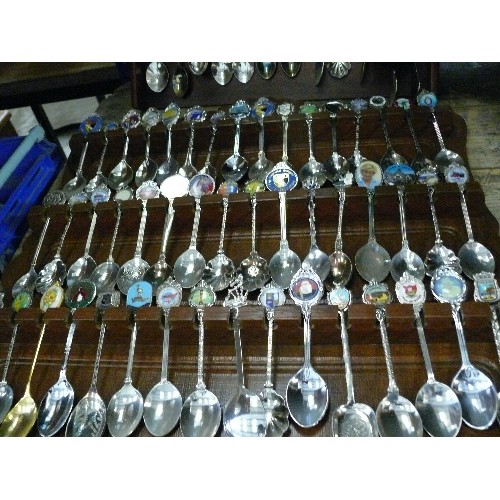 525 - TWO RACKS OF COLLECTORS SPOONS