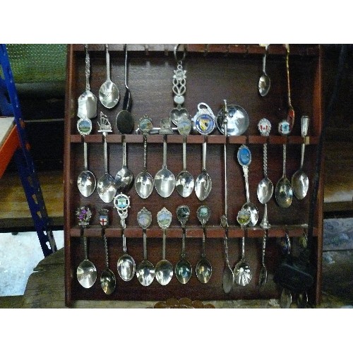 525 - TWO RACKS OF COLLECTORS SPOONS