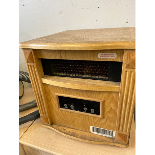 566 - UNUSUAL WOODEN CASED ELECTRIC HEATER