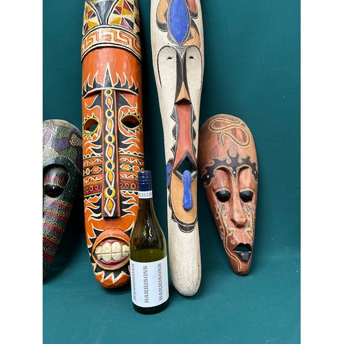 274 - A collection of 5 African and Indonesian wall masks, the largest 110cm