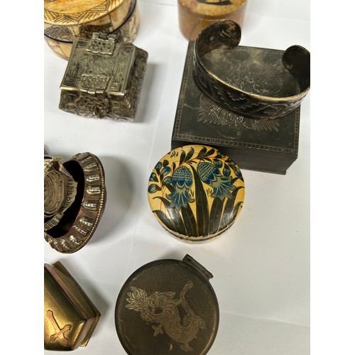 306C - Interesting collection of boxes and metalware to include a Tibetan prayer wheel, Indian papier mache... 