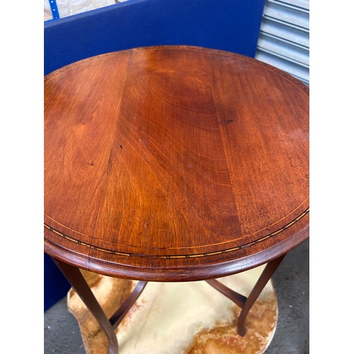 459 - An Edwardian mahogany circular occasional table, the top with boxwood and ebony stringing. 60cm dia