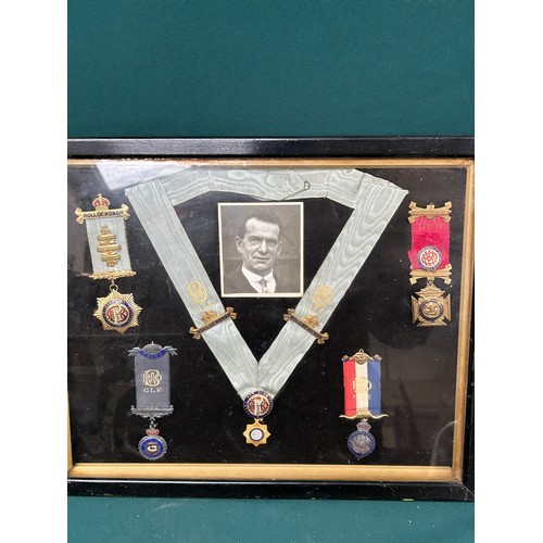 99A - A framed collection of 1930's & 40's  Royal Antediluvian Order of Buffaloes medals and jewels, with ... 