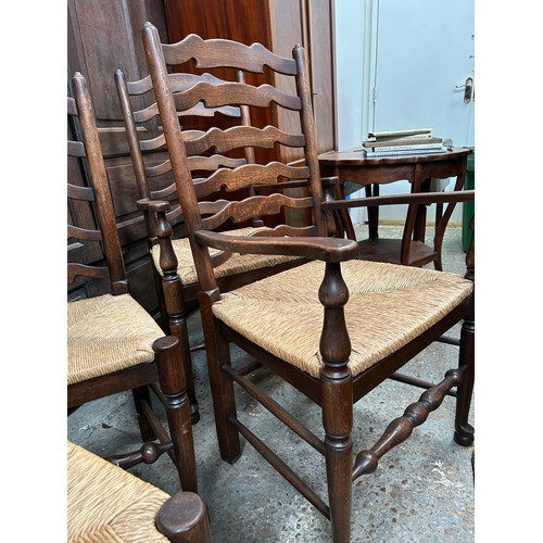 446 - Good set of eight 20th Century solid oak ladderback dining chairs including two carvers,  with drop ... 