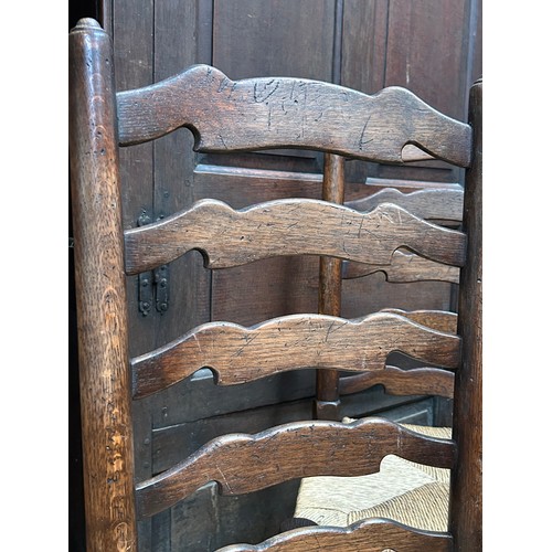 446 - Good set of eight 20th Century solid oak ladderback dining chairs including two carvers,  with drop ... 