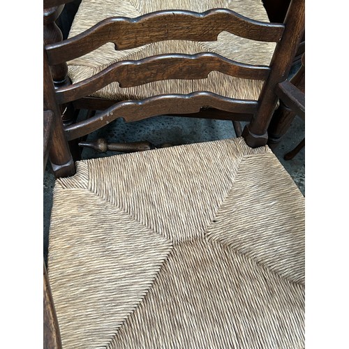 446 - Good set of eight 20th Century solid oak ladderback dining chairs including two carvers,  with drop ... 