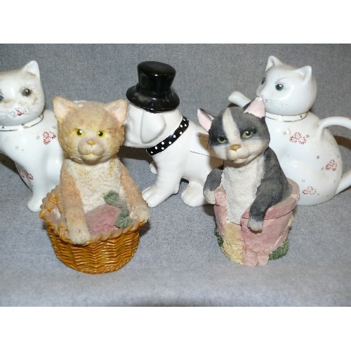 319 - A COLLECTION OF DECORATIVE CAT TEAPOTS  AND DOGS