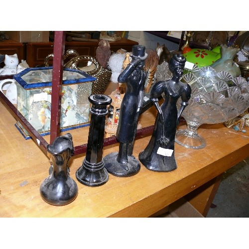 334 - A PAIR OF BLACK CERAMIC FIGURINES PLUS A CANDLESTICK AND A JUG