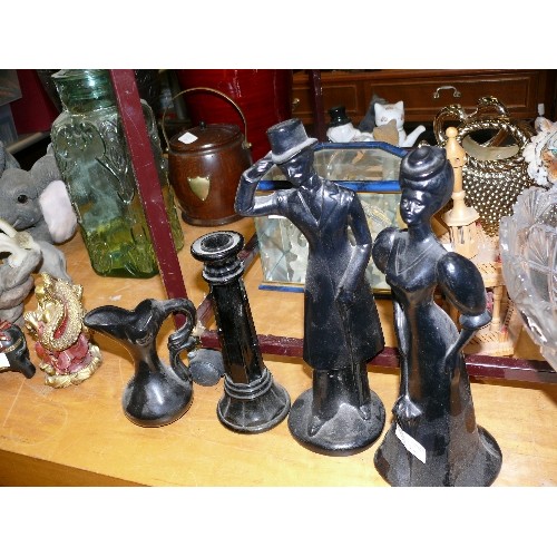 334 - A PAIR OF BLACK CERAMIC FIGURINES PLUS A CANDLESTICK AND A JUG