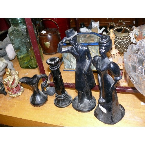 334 - A PAIR OF BLACK CERAMIC FIGURINES PLUS A CANDLESTICK AND A JUG