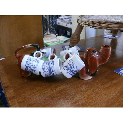 424 - MID CENTURY POTTERY DACHSHUND CARRYING 5 MINIATURE MUGS