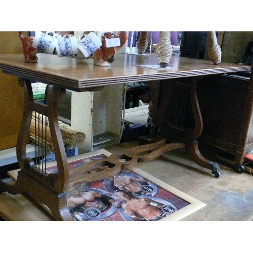 426 - GOOD QUALITY WALNUT VENEERED LYRE END COFFEE TABLE WITH LION PAW FEET