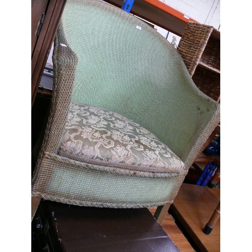 438 - LLOYD LOOM GREEN COMMODE CHAIR (DECORATED WITH A PLANT)