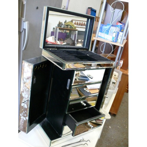 472 - AN ATTRACTIVE MIRRORED JEWELLERY BOX WITH DRAWERS AND SIDE DOORS FOR NECKLACES