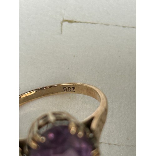 37D - A vintage  9ct gold ring with large oval cut amethyst coloured stone, marked 9ct, size M 3.16 GR