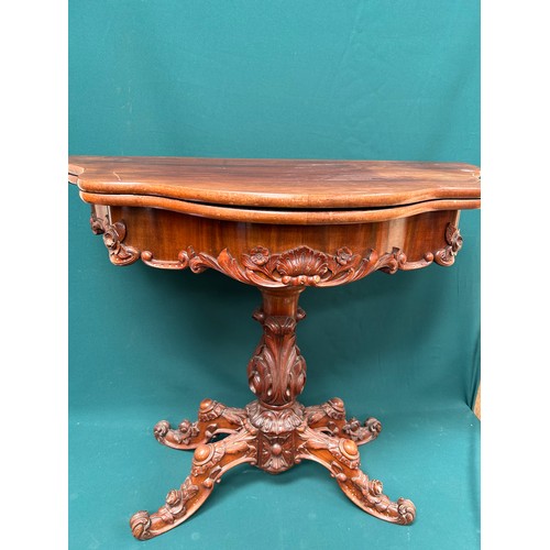 451A - Victorian mahogany fold over card table with acanthus leaf carving to column and carved flowers to t... 